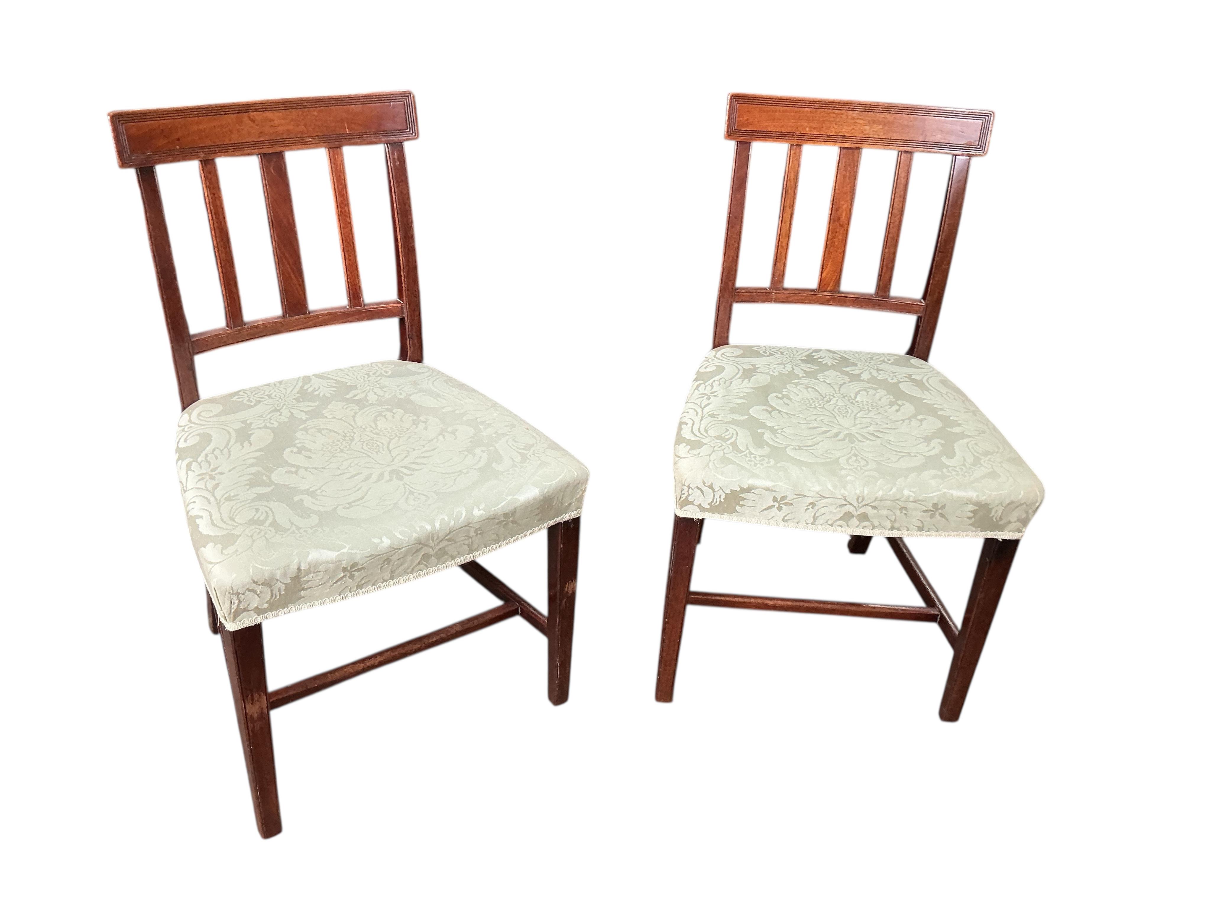 A set of six George III style mahogany dining chairs, two with arms